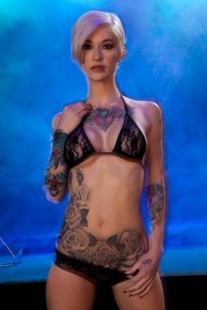 Hot tattooed Kleio Valentien sheds black lace panties to squat & spread legs on girlsfans.net
