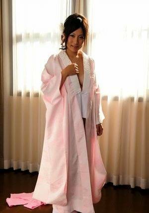Japanese solo girl slips off her robe to reveal her nice boobs in white socks - Japan on girlsfans.net