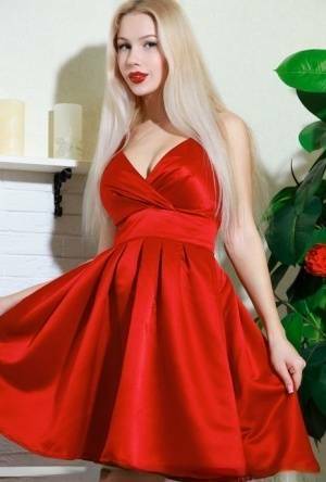 Nice blonde teen Genevieve Gandi removes red dress to display her trimmed muff on girlsfans.net
