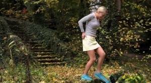 Cute blonde Victoria Pure hikes her skirt to take a pee along country lane on girlsfans.net