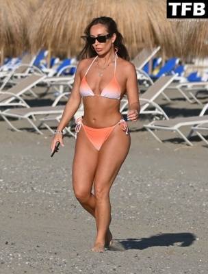 Lauryn Goodman Displays Her Sexy Bikini Body on the Beach on Holiday in Marbella on girlsfans.net