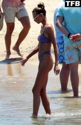 Alina Baikova Displays Her Slender Bikini Body on the Beach on girlsfans.net