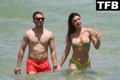 Arthur Melo Hits the Beach with His Girlfriend in Miami on girlsfans.net