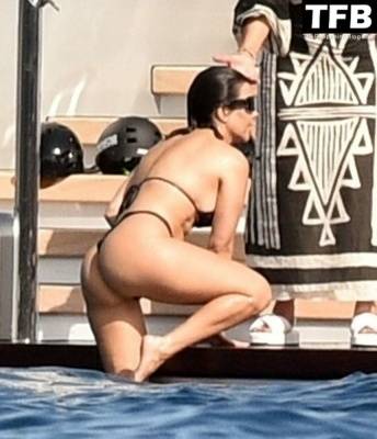 Kourtney Kardashian Shows Off Her Toned Bikini Body While Enjoying Some Quality Time with Travis Barker on girlsfans.net