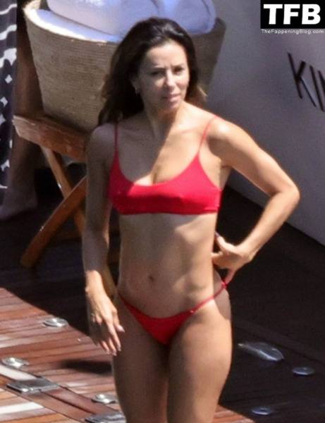 Eva Longoria Showcases Her Stunning Figure and Ass Crack in a Red Bikini on Holiday in Capri on girlsfans.net